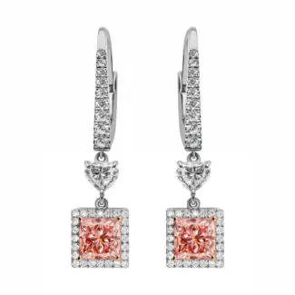 Pink diamond earrings featuring princess cut vivid pink diamonds, halo of diamonds, heart-cut diamond connector and lever-back mechanism