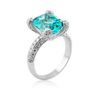 Paraiba ring feauturing an oval cut neon blue tourmaline and fat diamond paved prongs crafted in white gold