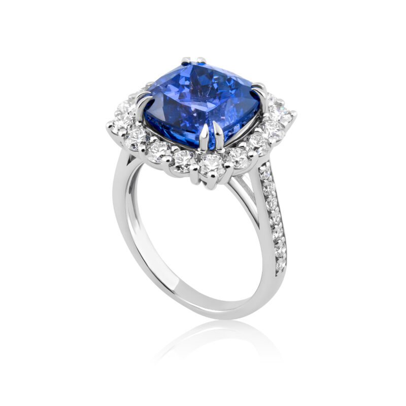 Tanzanite ring with a square cushion cut tanzanite as the center stone and a diamond halo