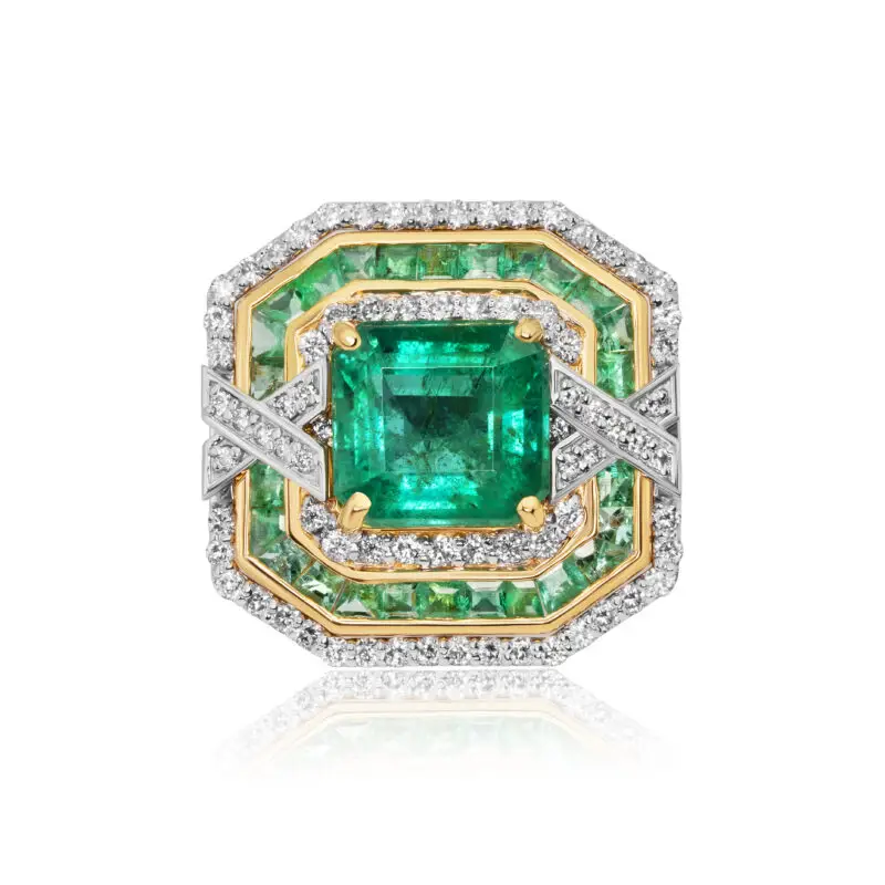 Art deco Zambian emerald ring with triple halo of diamonds and emeralds crafted in white gold and yellow gold baskets and inlays