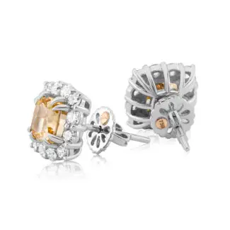 Yellow diamond studs cradfted in white gold surrounded by a halo of diamonds