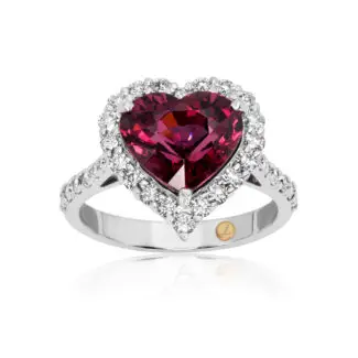 Heart cut rhodolite ring with a diamond halo set in white gold