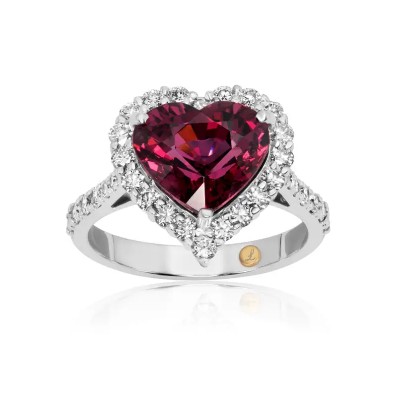 Heart cut rhodolite ring with a diamond halo set in white gold