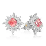 Pink Diamond Studs featuring vivid pink cushion cut diamonds, surrounded by a halo of pear and marquiese-cut diamonds