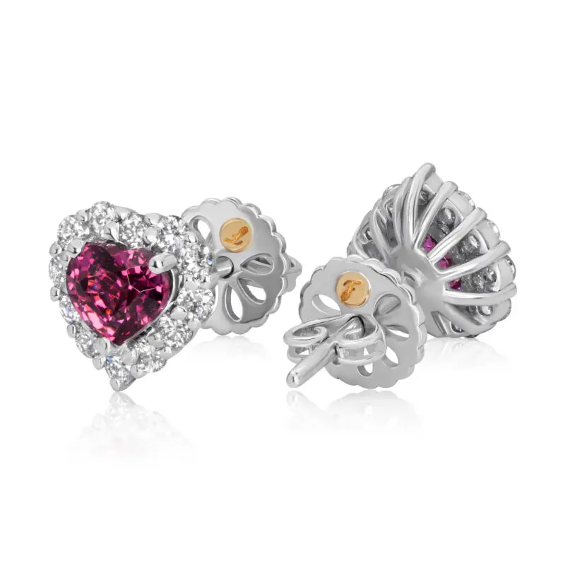 Rhodolite studs featuring purplish pink garnets surrounded by a halo of diamonds